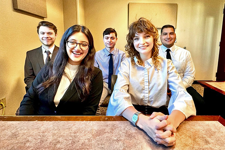 A team of Middle Tennessee State University students prepare to present their first-place entry for a competition at the virtual AIS 2023 Student Chapter Leadership Conference. Pictured, from left, are Avery Wriedt, Havjin Barkhan, Gabriel Kapu, Syd Panak and Alberto Melchor. (Photo courtesy of Michael Erskine)