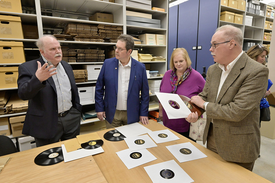 Mike Doubler, director of the Macon-Doubler Fellowship, talks with his siblings, from left, Paul Doubler, Katie Doubler Steuart and John Doubler, in the archives of the Center for Popular Music at Middle Tennessee State University on Nov. 20, 2023, when the fellowship announced grant funding for scholars researching their great-grandfather, the late Uncle Dave Macon, who was regarded as the first superstar of the Grand Ole Opry. The CPM has the largest collection of memorabilia chronicling and presering the legacy of Dave Macon. (MTSU photo by Andy Heidt)