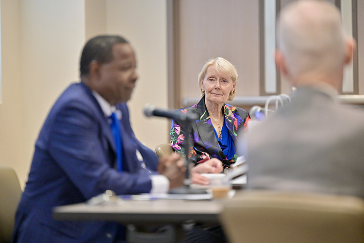 Middle Tennessee State University Board of Trustees Vice Chair Christine Karbowiak Vanek, center, listens to remarks from President Sidney A. McPhee, left, during the board’s quarterly meeting Dec. 6, 2023, in the Miller Education Center during which she was unanimously reelected to a second straight two-year term as board vice chair. In the foreground at right is Trustee Tom Boyd. (MTSU photos by J. Intintoli)