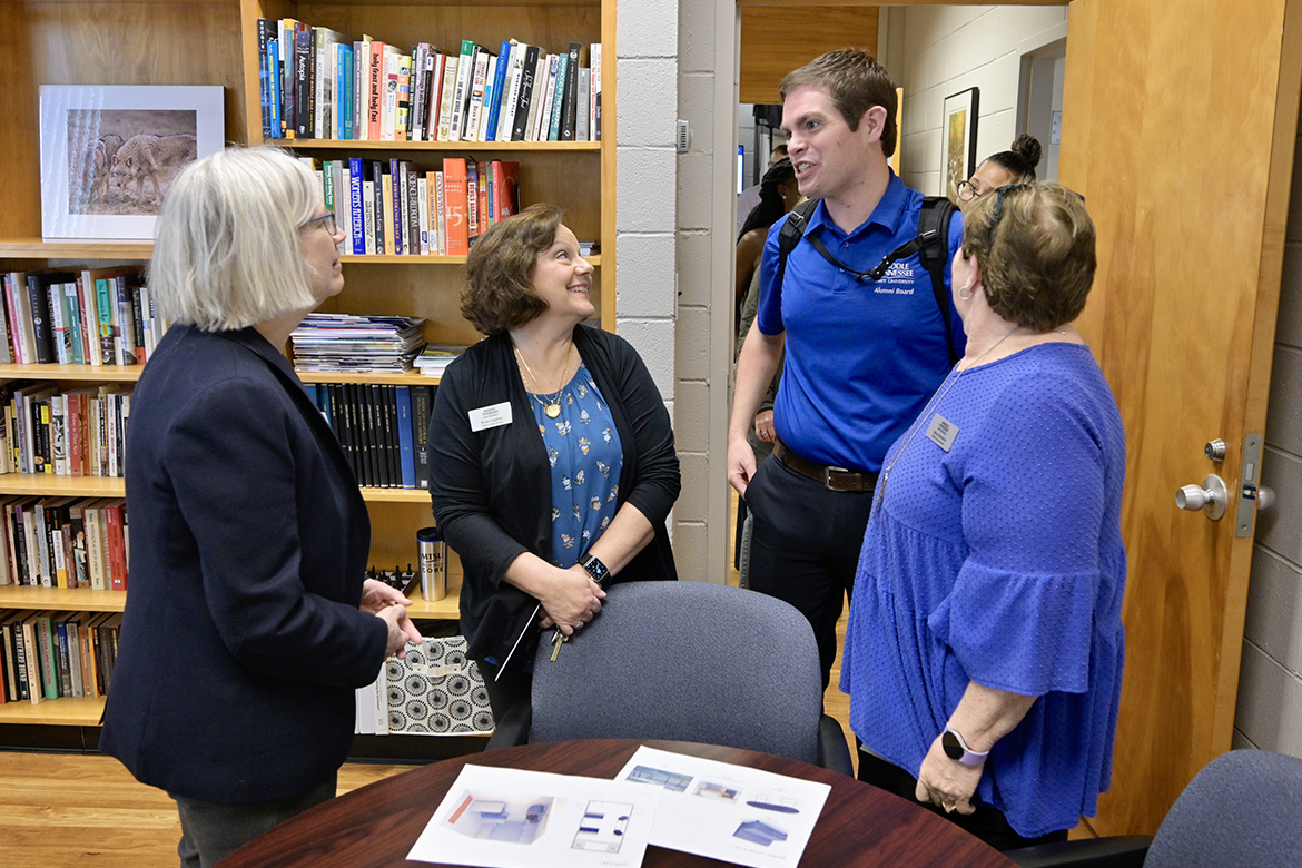 Middle Tennessee State University General Education Director Dr. Susan Myers-Shirk, left, chats with Matthew Hibdon, center, Mitzi Brandon and Paula Calahan at the True Blue Core ribbon cutting held Feb. 26. (MTSU Photo by Andy Heidt)