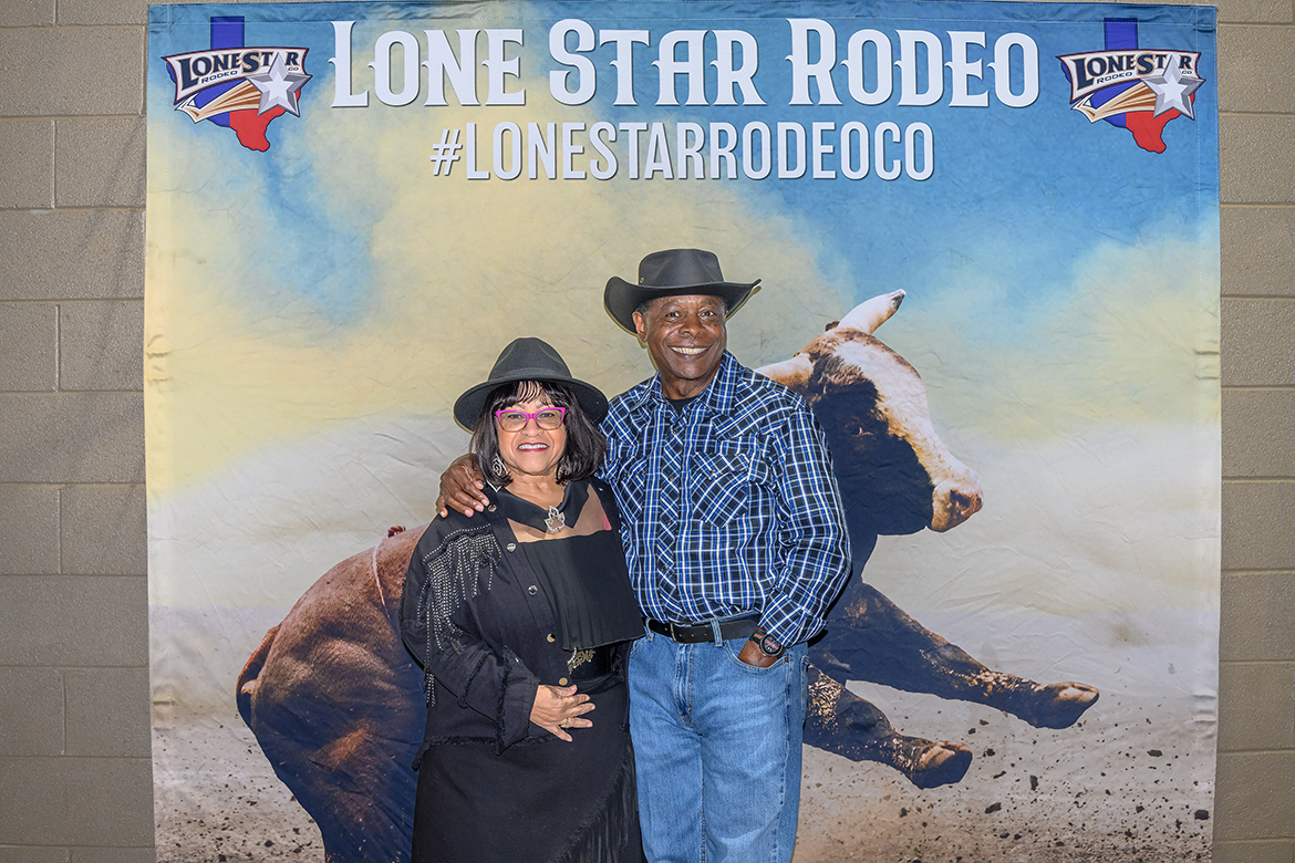 Middle Tennessee State University President Sidney A. McPhee, right, and first lady Elizabeth McPhee pose in front of Lone Star Rodeo promotional signage in March 2023 while attending the CFRC Rodeo hosted by The Community Foundation of Rutherford County and held at Tennessee Miller Coliseum, 304B W. Thompson Lane, in Murfreesboro, site of the 2024 rodeo at 7 p.m. Friday and Saturday, March 1-2. MTSU is one of the event’s key sponsors. (MTSU file photo by James Cessna)