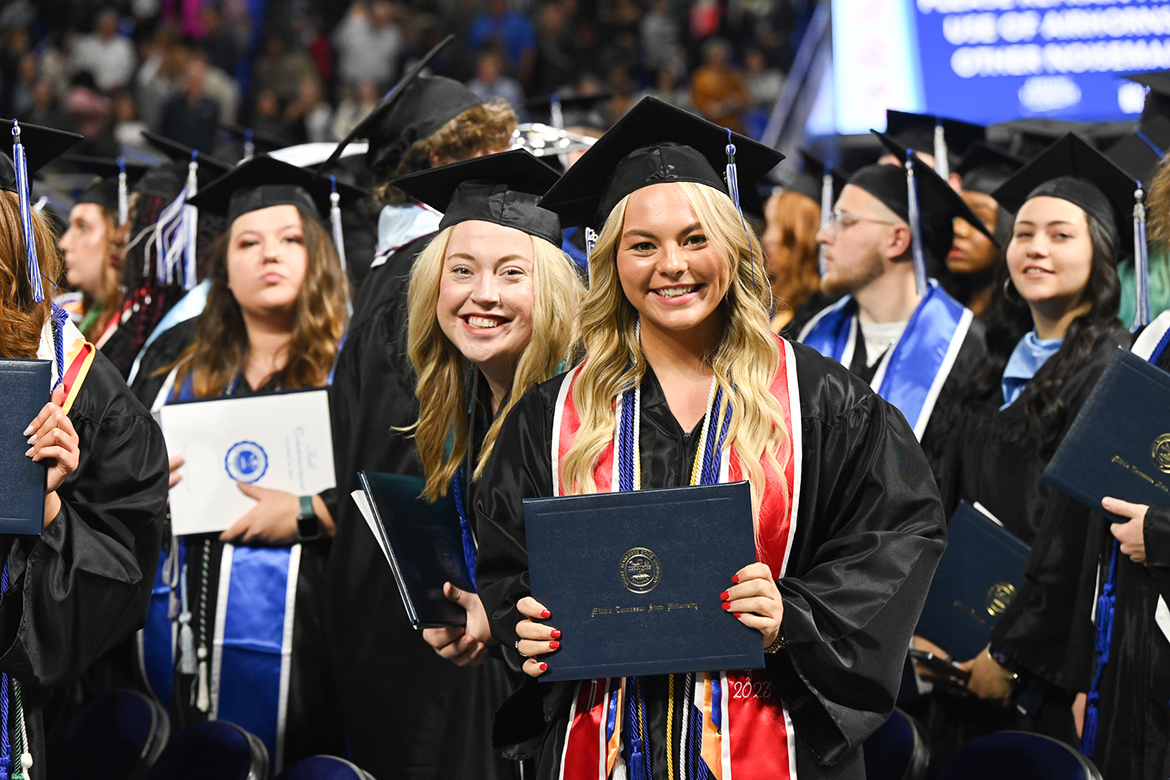 Middle Tennessee State University’s Class of 2023 graduates smile broadly after receiving their diplomas during fall commencement ceremonies held at Murphy Center. (MTSU photo)