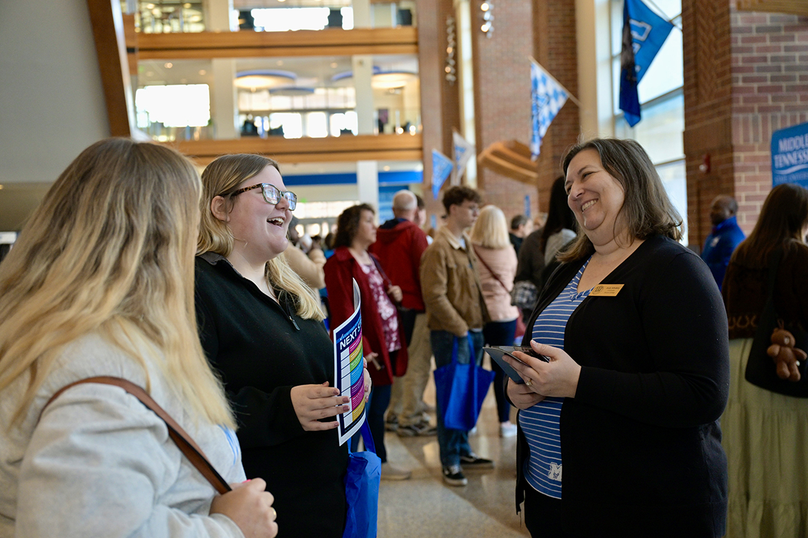 University Honors College academic advisor Judy Albakry, right, and a prospective student share a laugh during the annual Honors Open House academic browsing session Monday, Feb. 19, in the Student Union first-floor atrium. Nearly 200 prospective students and their parents attended the event. (MTSU photo by Andy Heidt)