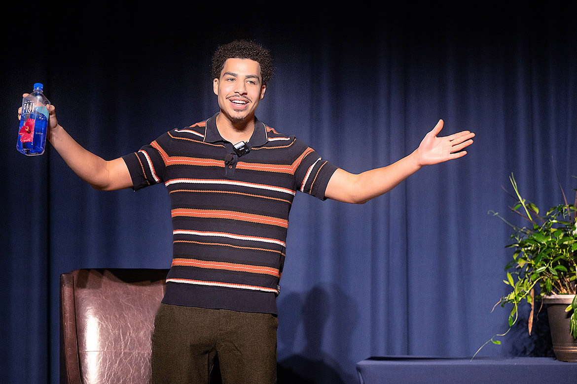 Award-winning actor Marcus Scribner, best known as Andre “Junior” Johnson in the syndicated comedy series, “Black-ish” walks onto stage with arms open wide to greet the crowd on Thursday, Feb. 22, in James Union Building ballroom as Middle Tennessee State University’s Black History Month keynote speaker. (MTSU photo by James Cessna)