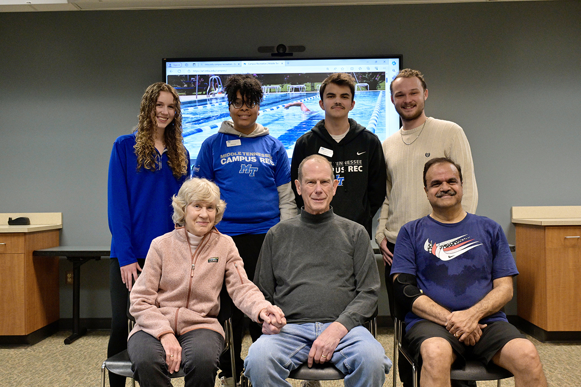 Retired Middle Tennessee State University professor and Computer Science Department Chair Richard Detmer, seated center, and his wife, Carol, seated left, visit with four MTSU Recreation Center student workers, standing, who helped save his life when he experienced cardiac arrest while playing racquetball Jan. 19 with marketing professor Raj Srivastava, seated right. The students, from left, are Julia Rutledge, Jasmine Jackson, Andrew Scrugham and Gatlin Murr. Now recovered, Detmer, 78, and his wife brought cookies Feb. 9 to thank the students and MTSU Campus Police for their life-saving responses. The students had received American Red Cross training to use CPR and AED equipment. (MTSU photo by Andy Heidt)