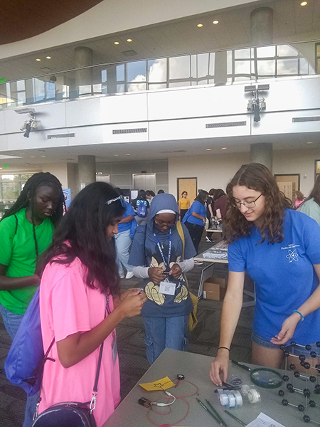 Ariel Nicastro, right, a Middle Tennessee State University sophomore physics major, works with attendees at the Women in Physics Workshop at the Science Building on campus in fall 2023. Nicastro and many other students interested in quantum science have been able to take part in such events thanks to the efforts of Hanna Terletska, associate professor of physics and astronomy, and a team of faculty and other collaborators who recently landed two National Science Foundation grants — totaling more than $1 million — that are funding greater access and opportunities in quantum education for students from all backgrounds through new quantum courses, research experiences, workshops, mentorship programs and more. (Submitted photo)
