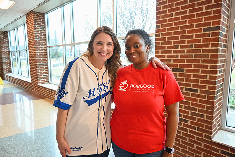Katie Schrodt, left, associate professor of education at Middle Tennessee State University, poses with Nichole Bell, alumna and teacher at Hobgood Elementary in Murfreesboro, Tennessee, at the College of Education Building on campus Feb. 10, 2024, as part of Southern Kid Literary Festival that Schrodt helped organize in partnership with the Rutherford Arts Alliance. (MTSU photo by Stephanie Wagner)