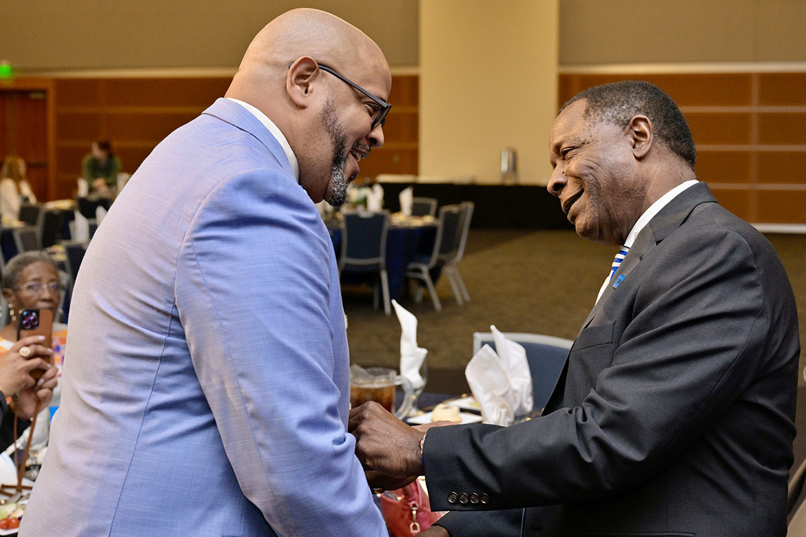 Middle Tennessee State University President Sidney A. McPhee, right, greets Dr. Cary E. Holman, keynote speaker for the 2024 Unity Luncheon held Thursday, Feb. 8, in the Student Union Ballroom. (MTSU photo by Andy Heidt)