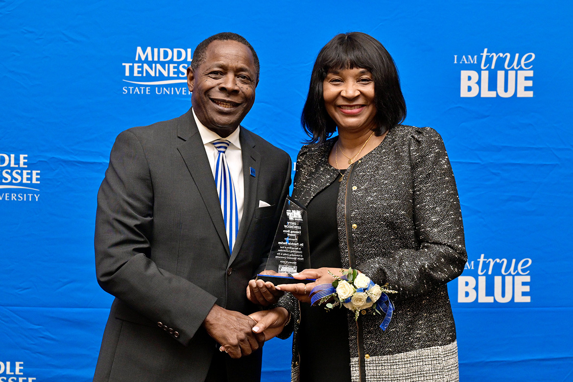 Middle Tennessee State University President Sidney A. McPhee, left, presents "unsung hero" Award for Advocate of Civility to Patricia Waire Harlan at the 2024 Unity Luncheon held Thursday, Feb. 8, in the Student Union Ballroom. (MTSU photo by Andy Heidt)