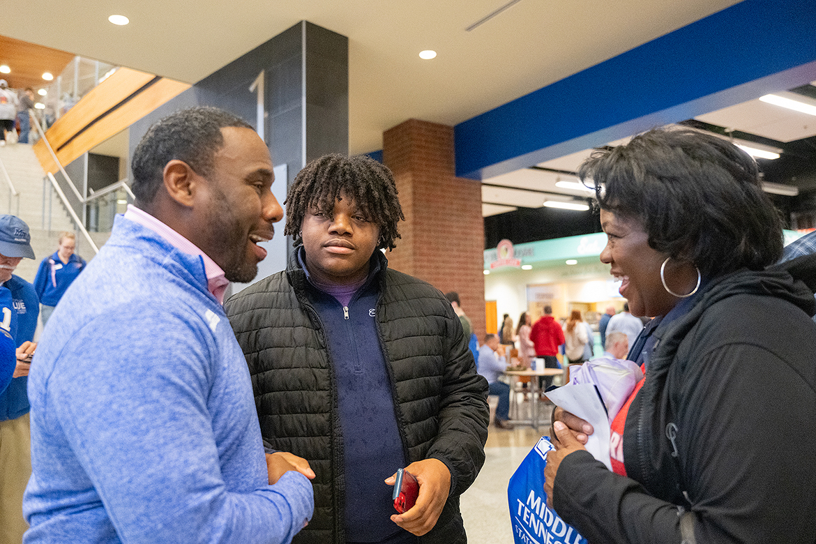 Middle Tennessee State University football coach Derek Mason talks to a prospective student and his mother Feb. 10 during the first True Blue Preview recruiting event for 2024 in the Student Union’s first-floor atrium. Hundreds of high school and transfer prospects and their parents will be on campus Saturday, March 23, for the second spring preview day. (MTSU photo by Cat Curtis Murphy)