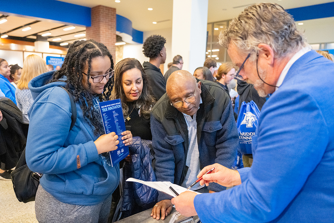 Doug Adams, right, a Middle Tennessee State University College of Basic and Applied Sciences advisor in the areas of biology and forensic sciences, covers options that a prospective student and her parents can consider at a browsing session during the Saturday, Feb. 10, True Blue Preview recruiting event in the Student Union’s first-floor atrium. MTSU offers the second spring preview day Saturday, March 23, with hundreds more prospective students and their parents planning to attend. (MTSU photo by Cat Curtis Murphy)