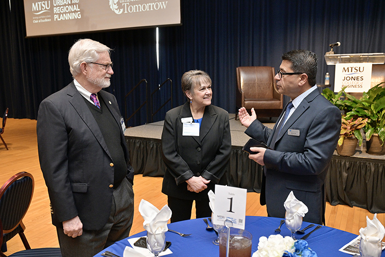 Middle Tennessee State University’s Murat Arik, right, holder of the Jennings and Rebecca Jones Chair of Excellence in Urban and Regional Planning, chats with Jones College of Business Dean Joyce Heames, center, and Paul Martin, chair of the COE-URP Advisory Committee, before the start of “A Forum on Growth and Challenges in Middle Tennessee” held March 15 in the James Union Building’s Tennessee Room at MTSU in Murfreesboro, Tenn. (MTSU photo by Andy Heidt)