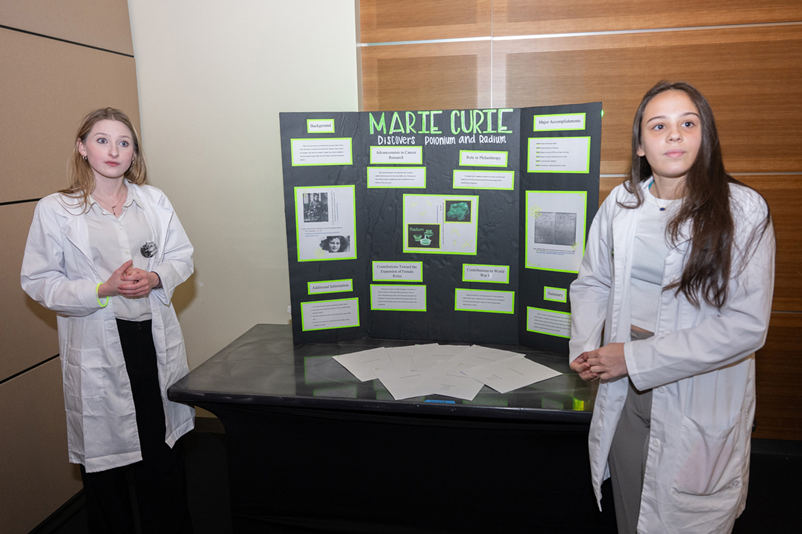 Central Magnet School students Mary Cotey and Madden Eller of Murfreesboro, Tenn., show off their exhibit on Marie Curie at the Middle Tennessee Regional History Day Competition held Friday, Feb. 23, at Middle Tennessee State University. Nearly 200 students sponsored by 20 teachers competed in five categories: papers, documentaries, websites, exhibits and performances. Winners qualified to advance to the state competition held April 20 in Nashville, and potentially National History Day held in June in Maryland. (MTSU photo by James Cessna)