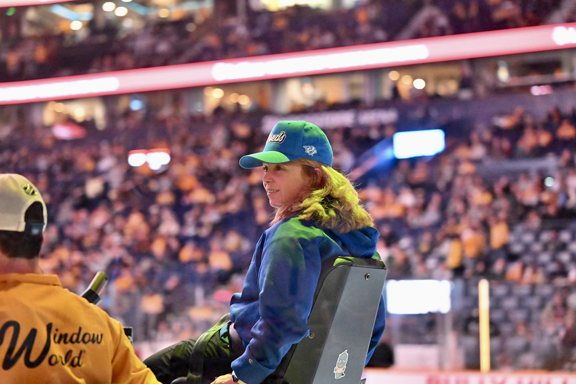 Debbie Hickerson, MTSU National Alumni Board President, rode in a Zamboni, the slow-moving machine that resurfaces the ice before the game and during intermission periods, Tuesday, March 19 at Bridgestone Arena in Nashville, Tenn. The NHL Nashville Predators hosted True Blue Night/Military Appreciation event. (MTSU PHOTO BY James Cessna)