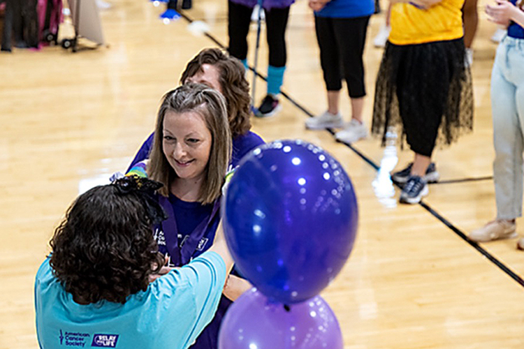 Middle Tennessee State University staffer and cancer survivor Middle Tennessee State University staffer and cancer survivor Lara Bodary, facing camera, shares a smile with another attendee at the 2023 Relay for Life at the Campus Recreation Center. This year’s event will be held 5 to 9 p.m. Friday, March 22, at the Rec. (Submitted photo)