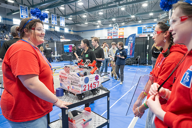 Members of the Tennessine Titans robotics team from Maryville, Tenn., transport their robot across the floor during the TNFIRST First Tech Challenge Tennessee State Championship Saturday, March 2, in Middle Tennessee State University’s Alumni Memorial Gym. The team qualified for the World Championships, to be held in Houston, Texas, in April. (MTSU photo by Cat Curtis Murphy)