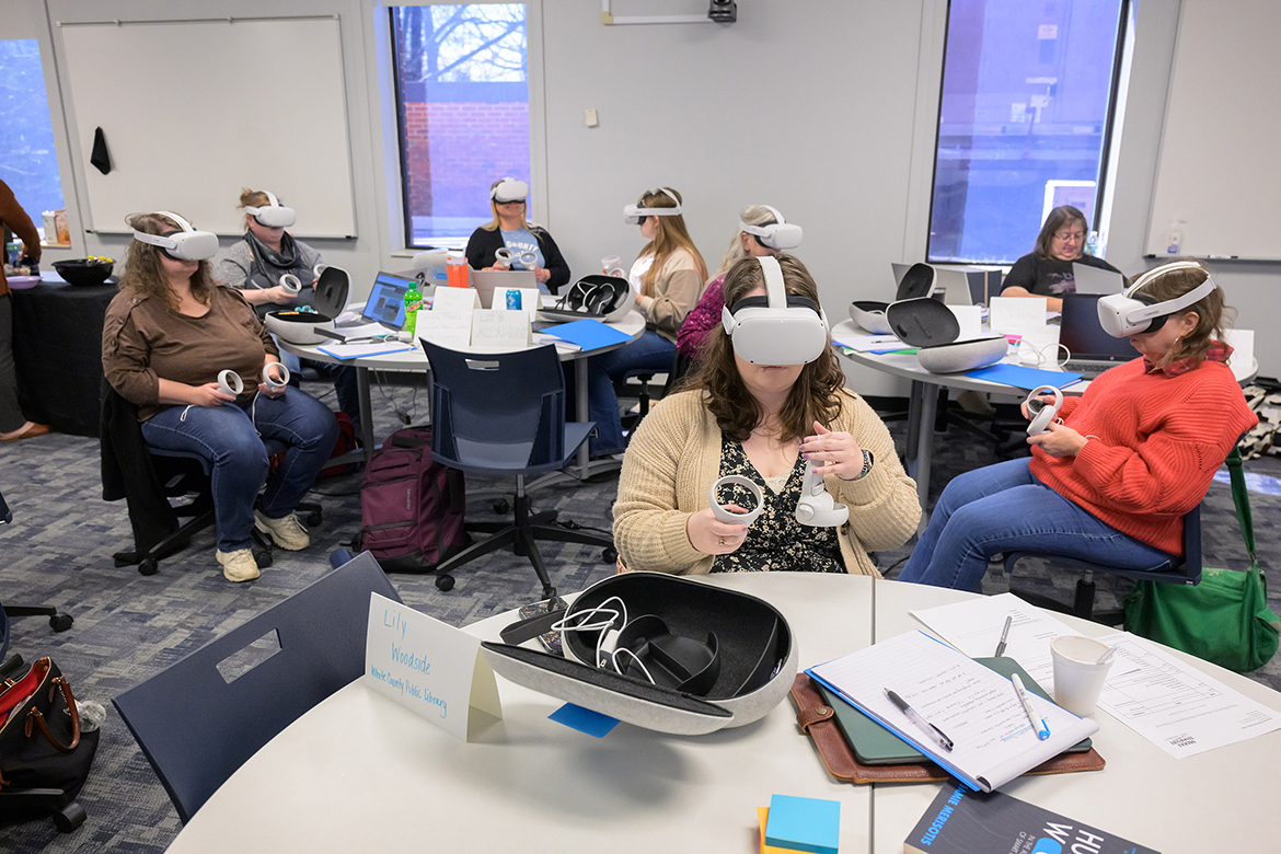 Participants including Lily Woodside, front center, from the White County Public Library in Sparta, Tenn., go through virtual reality training provided by Transfr recently in a Middle Tennessee State University Fairview Building classroom in Murfreesboro, Tenn. The training will help the librarians from six rural counties assist their patrons in pursuing job opportunities with the same VR technology. A federal grant from the Institute of Museum and Library Services obtained by MTSU’s School of Agriculture is aiding in the effort. (MTSU photo by Andy Heidt)