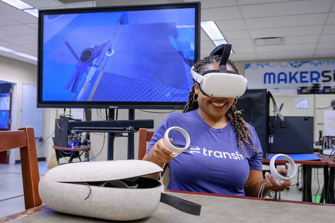 Middle Tennessee State University alumna Arielle Woodmore from Transfr, a company specializing in virtual reality technology, shows off the equipment last fall at the university’s James E. Walker Library MakerSpace area in Murfreesboro, Tenn. The technology will be used for career training in six rural counties and paid for using a federal grant from the Institute of Museum and Library Services and managed by MTSU’s School of Agriculture. (MTSU photo by J. Intintoli)