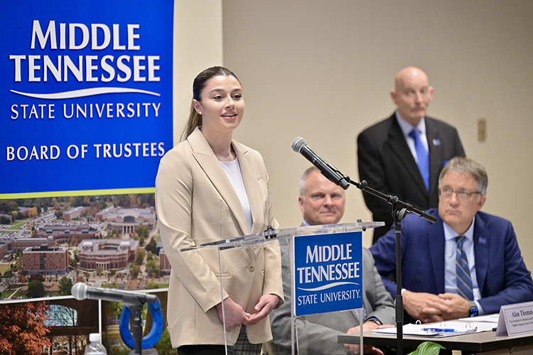 Middle Tennessee State University senior and Army veteran Skylar Pilcher discusses her military and academic journey at the MTSU Board of Trustees quarterly meeting held Tuesday, March 19, at the Miller Education Center on Bell Street in Murfreesboro, Tenn. Pilcher will graduate in May with a bachelor’s degree in business administration/information systems and analytics and hopes to begin a career in cybersecurity. Also pictured are, standing right, retired Lt. Gen. Keith Huber, senior advisor for veterans and leadership initiatives; Provost Mark Byrnes, seated right; and Alan Thomas, vice president for business and finance. (MTSU photo by J. Intintoli)
