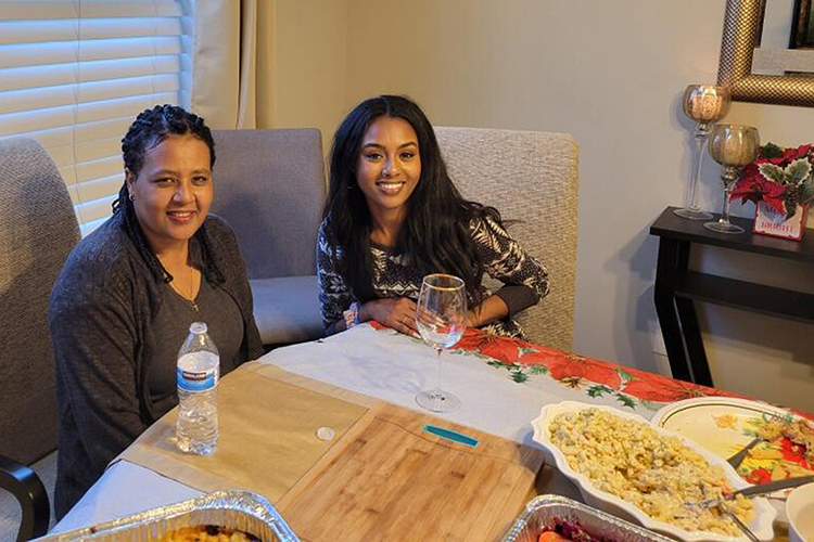 Middle Tennessee State University senior biology major Faben Zeleke of Smyrna, Tenn., right, prepares to share a meal with her mother, Tsehaye, who was diagnosed with colon cancer. Faben will share her family’s story at MTSU’s Relay for Life fundraising event set for 5 to 9 p.m. Friday, March 22, at the Health, Wellness and Recreation Center on campus. (Submitted photo)