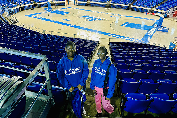 Two members of the Legacy Tour group from The Bahamas pose for a photo recently inside Hale Arena at Murphy Center on the Middle Tennessee State University campus in Murfreesboro, Tenn. The group of about 30 Bahamian students and 10 parental chaperones spent the day at MTSU thanks to an invitation from the Office of International Affairs to learn more about the Blue Raider community and their opportunities for international education here. (MTSU photo by Matthew Wells)