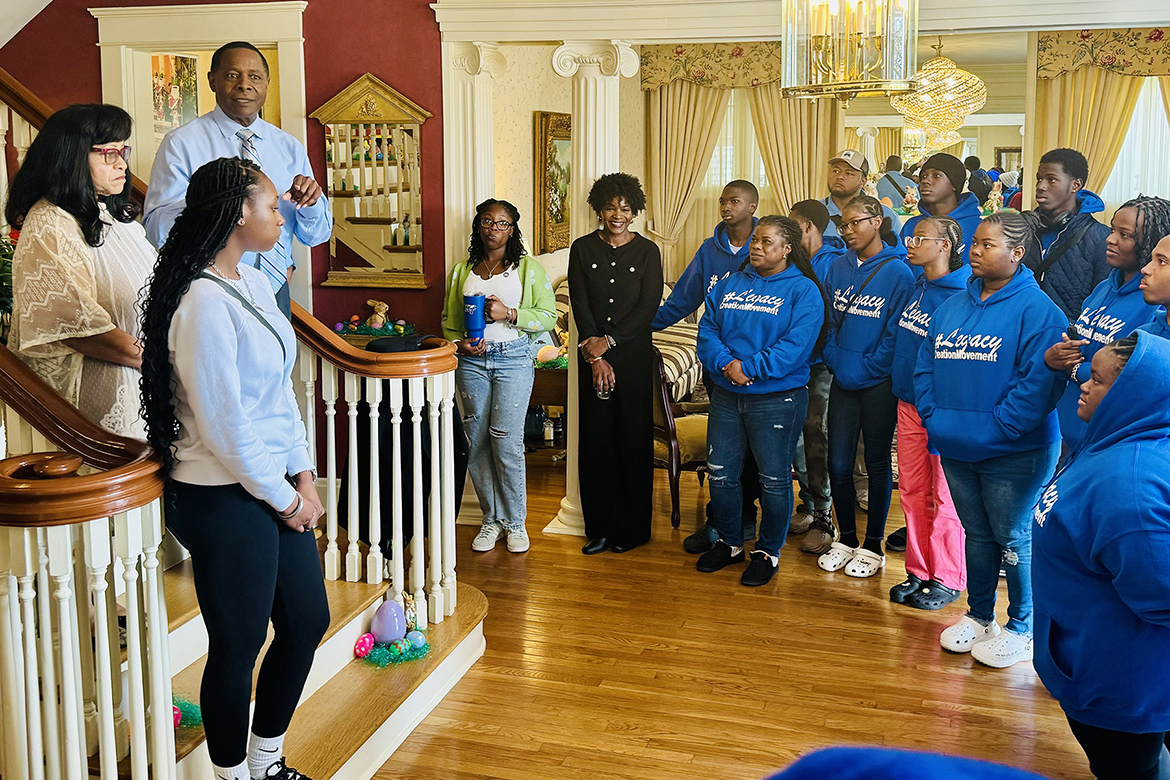 Middle Tennessee State University President Sidney A. McPhee, second from left on staircase, speaks recently to members of the Legacy Tour group from The Bahamas during their stop at the President’s House on the MTSU campus in Murfreesboro, Tenn. At far left is MTSU first lady Elizabeth McPhee and in front of her is current Bahamian student Danelle Gibson. The tour group of about 30 Bahamian students and 10 parental chaperones spent the day on campus thanks to an invitation from the Office of International Affairs to learn more about the Blue Raider community and their opportunities for international education here. (MTSU photo by Matthew Wells)