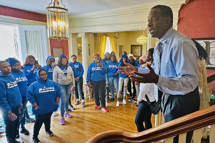 Middle Tennessee State University President Sidney A. McPhee, right, speaks recently to members of the Legacy Tour group from The Bahamas during their stop at the President’s House on the MTSU campus in Murfreesboro, Tenn. Behind him is MTSU first lady Elizabeth McPhee and in front of her is current Bahamian student Danelle Gibson. The tour group of about 30 Bahamian students and 10 parental chaperones spent the day on campus thanks to an invitation from the Office of International Affairs to learn more about the Blue Raider community and their opportunities for international education here. (MTSU photo by Matthew Wells)