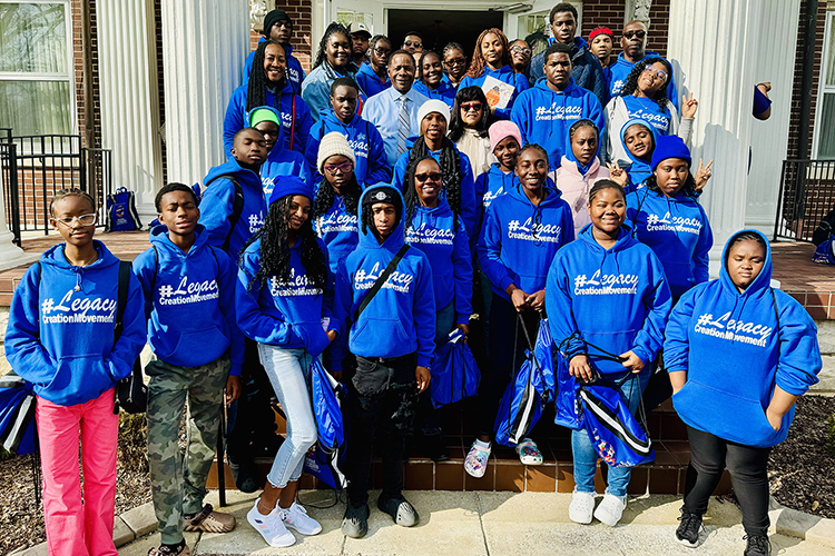 Middle Tennessee State University President Sidney A. McPhee, center left in tie, and first lady Elizabeth McPhee, center right, take a photo recently with the Legacy Tour group from The Bahamas during their stop at the President’s House on the MTSU campus in Murfreesboro, Tenn. The group of about 30 Bahamian students and 10 parental chaperones spent the day touring campus thanks to an invitation from the Office of International Affairs to learn more about the Blue Raider community and their opportunities for international education here. (MTSU photo by Matthew Wells)
