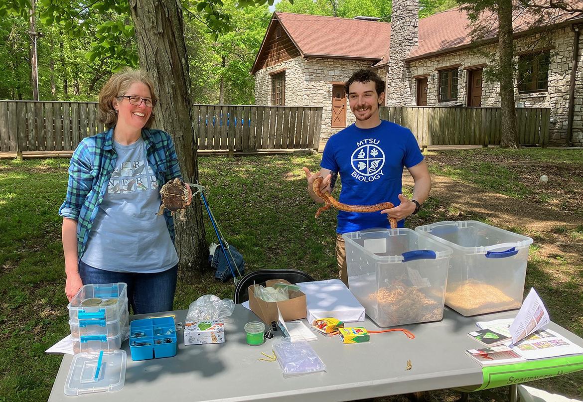 Lori Klukowski, left, a Middle Tennessee State University master’s in science education doctoral student, and former MTSU biology research scientist Alex Romer shared about the turtle, snake and other creatures on display at the animal table during the 2023 Elsie Quarterman Cedar Glade Festival at Cedars of Lebanon State Park, five miles south of Lebanon, Tenn., on U.S. 231. This year’s 46th annual event will be held Friday through Sunday, May 3-5. The MTSU Center for Cedar Glade Studies partners with the park to hold the event. (Submitted photo)