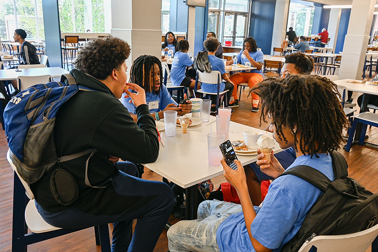 Middle Tennessee State University students and students from Oakland Middle School in Murfreesboro, Tenn., enjoy an all-you-can-eat lunch at MTSU’s McCallie Dining Hall on April 12, 2024. (MTSU photo by Stephanie Wagner)