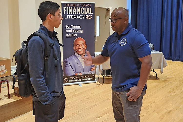 U.S. Army veteran and author Michael “Bootcamp” Thomas, left, chats with a student following his keynote address for Middle Tennessee State University’s Financial Literacy Month on April 10 in the Tennessee Room of the James Union Building on the MTSU campus in Murfreesboro, Tenn. MTSU’s Department of Economic and Finance has hosted financial literacy events throughout the month. (MTSU photo by Jimmy Hart)