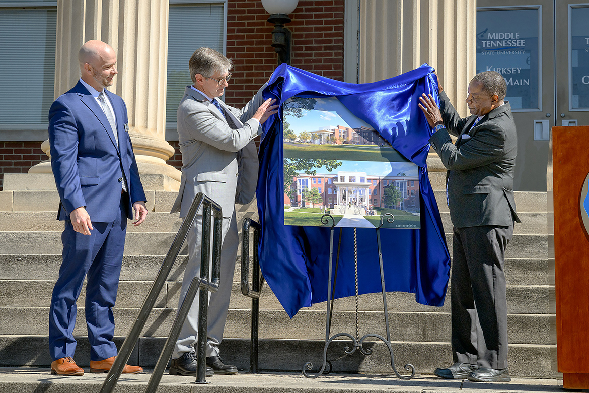 Middle Tennessee State University leaders unveil the artist renderings Wednesday, April 24, on the steps of Kirksey Old Main of the $54.3 million renovation project to upgrade Kirksey and Rutledge Hall on the MTSU campus in Murfreesboro, Tenn. Pictured, from left, are Matthew Duncan, University Studies Department chair; Greg Van Patten, dean of the College of Basic and Applied Sciences; and MTSU President Sidney A. McPhee. The project begins in mid-May with an expected completion by summer 2026, with Kirksey housing multiple CBAS departments and Rutledge converting to an academic building house University Studies. (MTSU photo by J. Intintoli)
