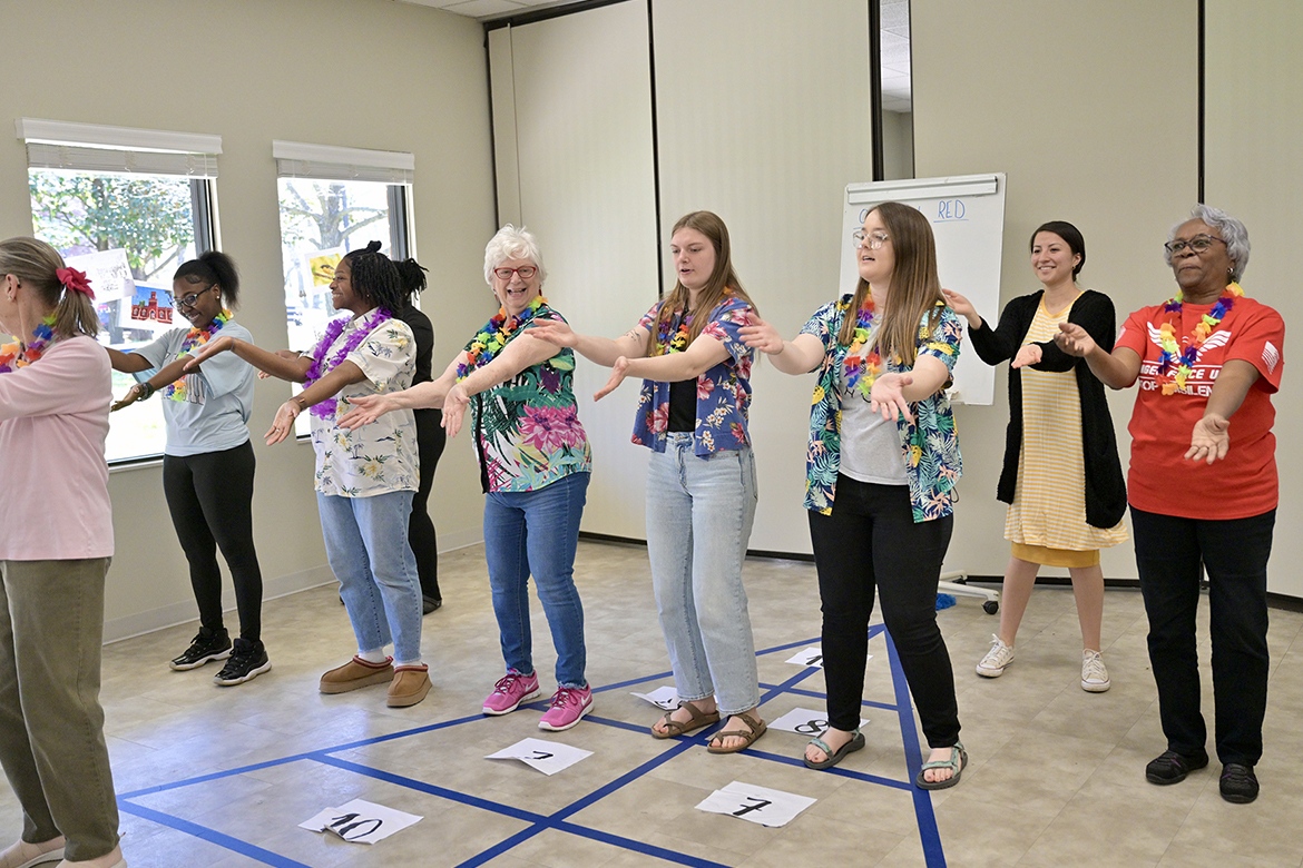 Students in the Aging Health and Development course at Middle Tennessee State University in Murfreesboro, Tenn., taught by Human Development and Family Science lecturer Samantha Weir, do the macarena dance with members of St. Clair Street Senior Center during a “cruise” party held as part of class on March 29, 2024. Each Friday during the semester, students plan and implement interactive games at St. Clair as well as Stones River Manor, also in Murfreesboro. (MTSU photo by J. Intintoli)
