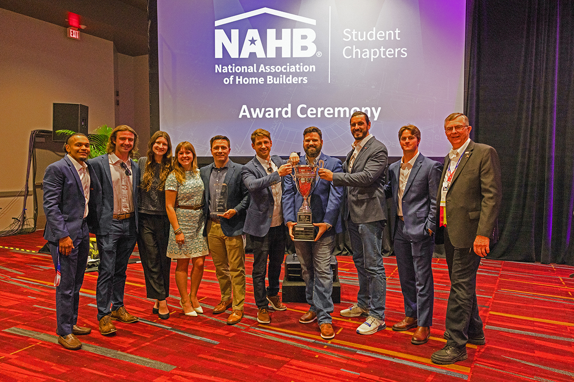 From left, project teammates Vidal Polk, John Crow, Allison Lampley, Annalise Phillips, Robert Deetjen, Alex Becker, Ronnie Merrill, John Timm, Brian Pierce and associate professor and mentor Duane Vanhook celebrate Middle Tennessee State University capturing the National Association of Home Builders Student Chapters first-place award at the Las Vegas, Nev., Convention Center earlier this year. (Submitted photo by Que Images LLC for NAHB)