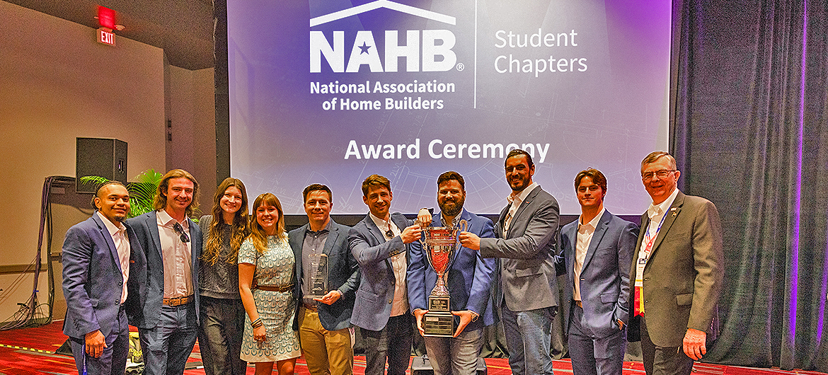 From left, project teammates Vidal Polk, John Crow, Allison Lampley, Annalise Phillips, Robert Deetjen, Alex Becker, Ronnie Merrill, John Timm, Brian Pierce and associate professor and mentor Duane Vanhook celebrate Middle Tennessee State University capturing the National Association of Home Builders Student Chapters first-place award at the Las Vegas, Nev., Convention Center earlier this year. (Submitted photo by Que Images LLC for NAHB)