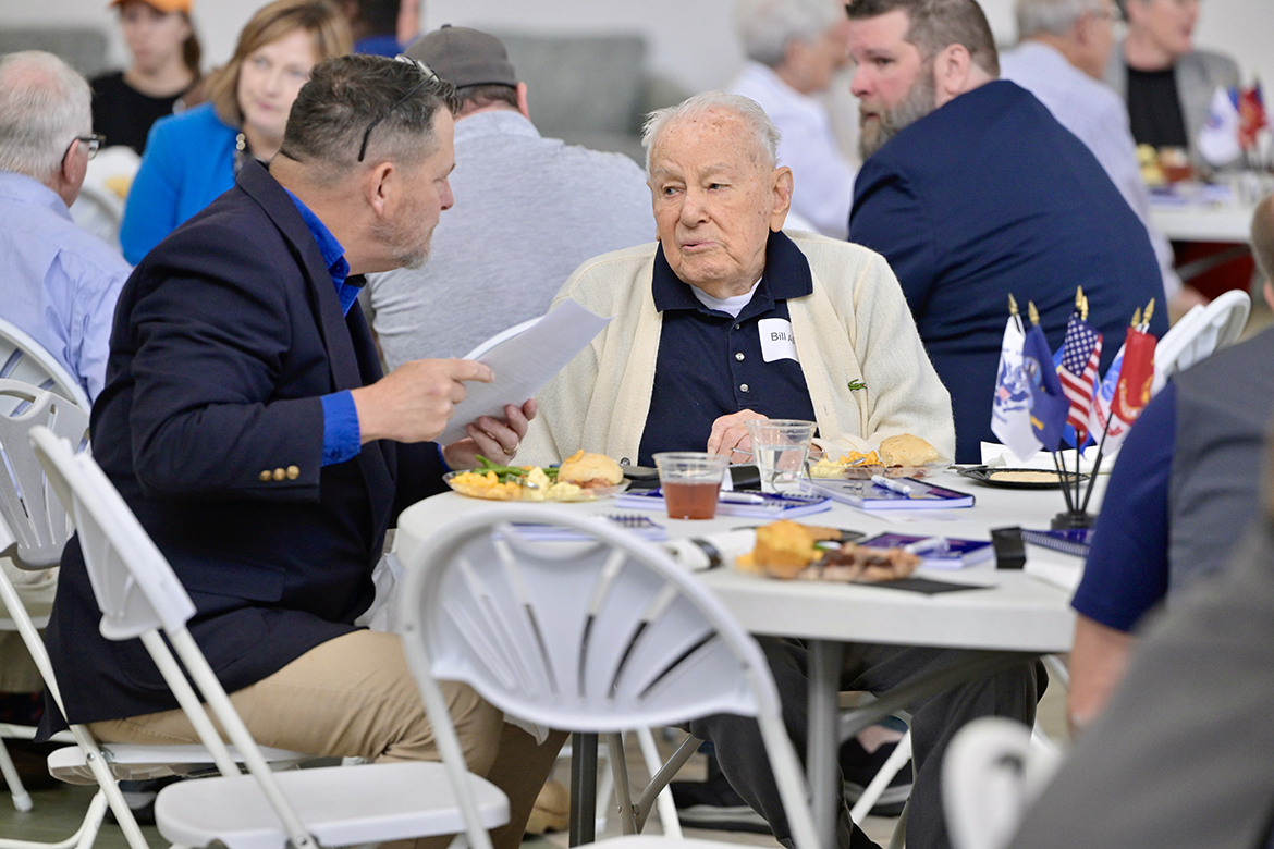 Rod Key, left, a military veteran and MTSU military-connected students’ career counselor at the Daniels Veterans Center, chats with World War II veteran Bill Allen of Murfreesboro, Tenn., Tuesday, April 23, in the Middle Tennessee State University Miller Education Center on Bell Street in Murfreesboro. They attended the luncheon and VA benefits’ information session for utility company employee-veterans working for Middle Tennessee Electric, United Communications and Consolidated Utility District of Rutherford County. Allen, who spent nearly 32 years working with Murfreesboro Electric before it merged with Middle Tennessee Electric, served in World War II and is one of 28 survivors on the U.S. Navy LST 523, sunk by an enemy mine during the invasion of Normandy, France, on June 19, 1944. (MTSU photo by Andy Heidt)