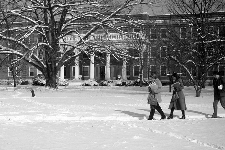 This undated historic photo shows two women walking outside Rutledge Hall, one of the five original buildings constructed on what was then Middle Tennessee State Normal School when founded in 1911 and is now Middle Tennessee State University. (MTSU file photo)