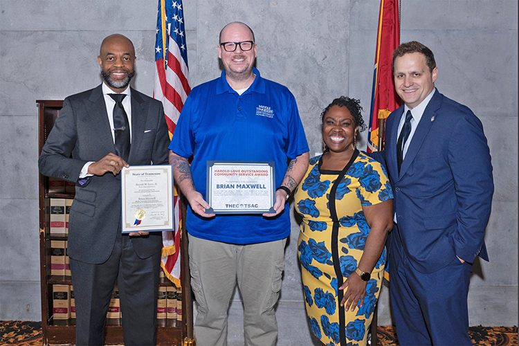 Middle Tennessee State University graduating senior video and film production major Brian Maxwell, second from left, receives his 2024 Harold Love Outstanding Community Service Award April 29 at the Tennessee Capitol in Nashville, Tenn. Presenting the award are, from left, state Rep. Harold Love Jr. of Nashville, Tennessee Higher Education Commission Director of HBCU Success Brittany Mosby and THEC Executive Director Steven Gentile. (Courtesy of the state of Tennessee)