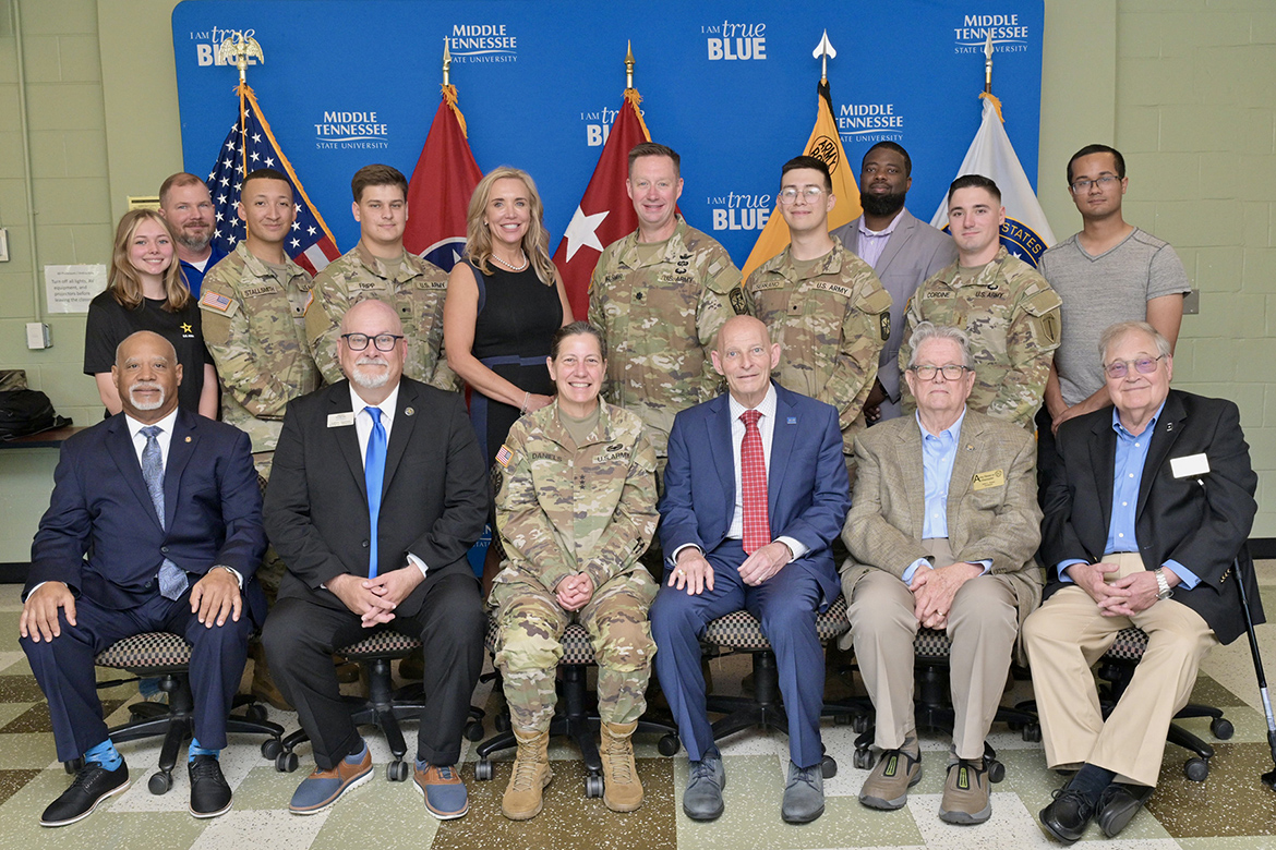 Lt. Gen. Jody Daniels, commanding general of the U.S. Army Reserve, seated third from right, and retired Army Lt. Gen. Keith Huber, senior adviser for veterans and leadership initiatives at Middle Tennessee State University, seated third from left, are shown at the MTSU Army ROTC Building with a group that includes Army Reserve ambassadors, veterans, cadets and MTSU administrators during Daniels’ visit Tuesday, May 21, to the campus in Murfreesboro, Tenn. (MTSU photo by J. Intintoli)