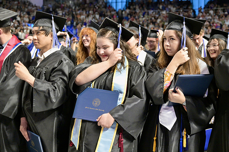 Proud Middle Tennessee State University graduates move their tassels from the right to the left to signify their new alumni status at the conclusion of the Friday, May 3, commencement ceremony at Murphy Center in Murfreesboro, Tenn. Two more ceremonies were held Saturday, May 4, to celebrate the total 2,439 graduates for the spring Class of 2024. (MTSU photo by J. Intintoli)