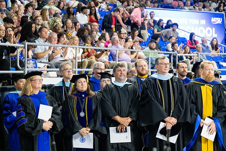 A group of Middle Tennessee State University faculty are recognized at the spring 2024 during the Saturday, May 4, morning commencement ceremony at Murphy Center in Murfreesboro, Tenn., the second of three ceremonies May 3-4. (MTSU photo by Cat Curtis Murphy)