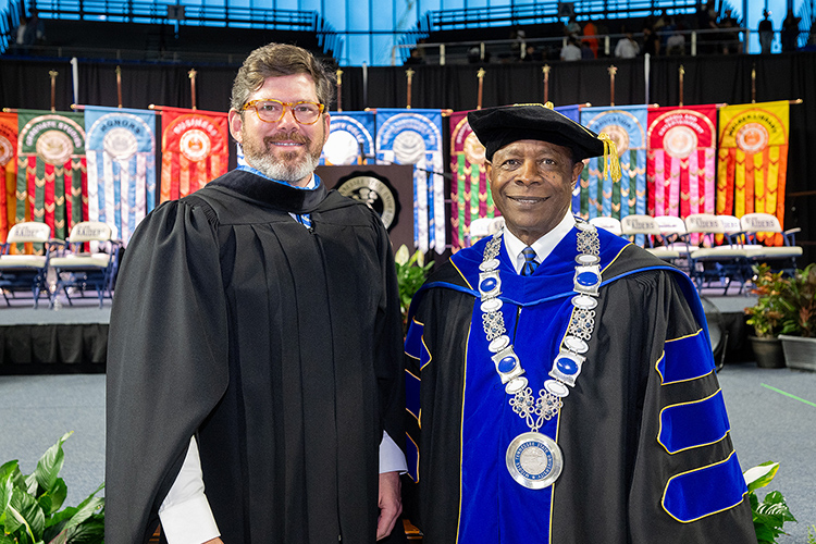 Middle Tennessee State University President Sidney A. McPhee, left, is showed with state Rep. Bob Freeman, an alumnus, who served as keynote speaker for the Saturday, May 4, morning spring commencement ceremony at Murphy Center in Murfreesboro, Tenn., the second of three ceremonies May 3-4. (MTSU photo by Cat Curtis Murphy)