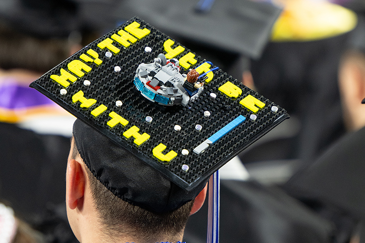 A Middle Tennessee State University graduate and obvious “Star Wars” fan dons his “May the 4th Be With You” mortarboard during the Saturday, May 4, morning spring commencement ceremony at Murphy Center in Murfreesboro, Tenn. It was the second of three ceremonies May 3-4. (MTSU photo by Cat Curtis Murphy)