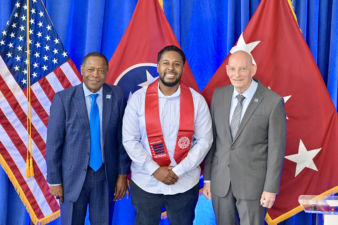 Middle Tennessee State University graduating senior student veteran Samuel Josil, center, receives congratulations from MTSU President Sidney A. McPhee, left, and Keith M. Huber, the university’s senior adviser for veterans and leadership initiatives and retired U.S. Army lieutenant general, Thursday, May 2, during the Graduating Veterans Stole Ceremony at the Miller Education Center on Bell Street in Murfreesboro, Tenn. Josil was among 50 student veterans attending the ceremony where they received a red stole to wear at commencement. (MTSU photo by Andy Heidt)