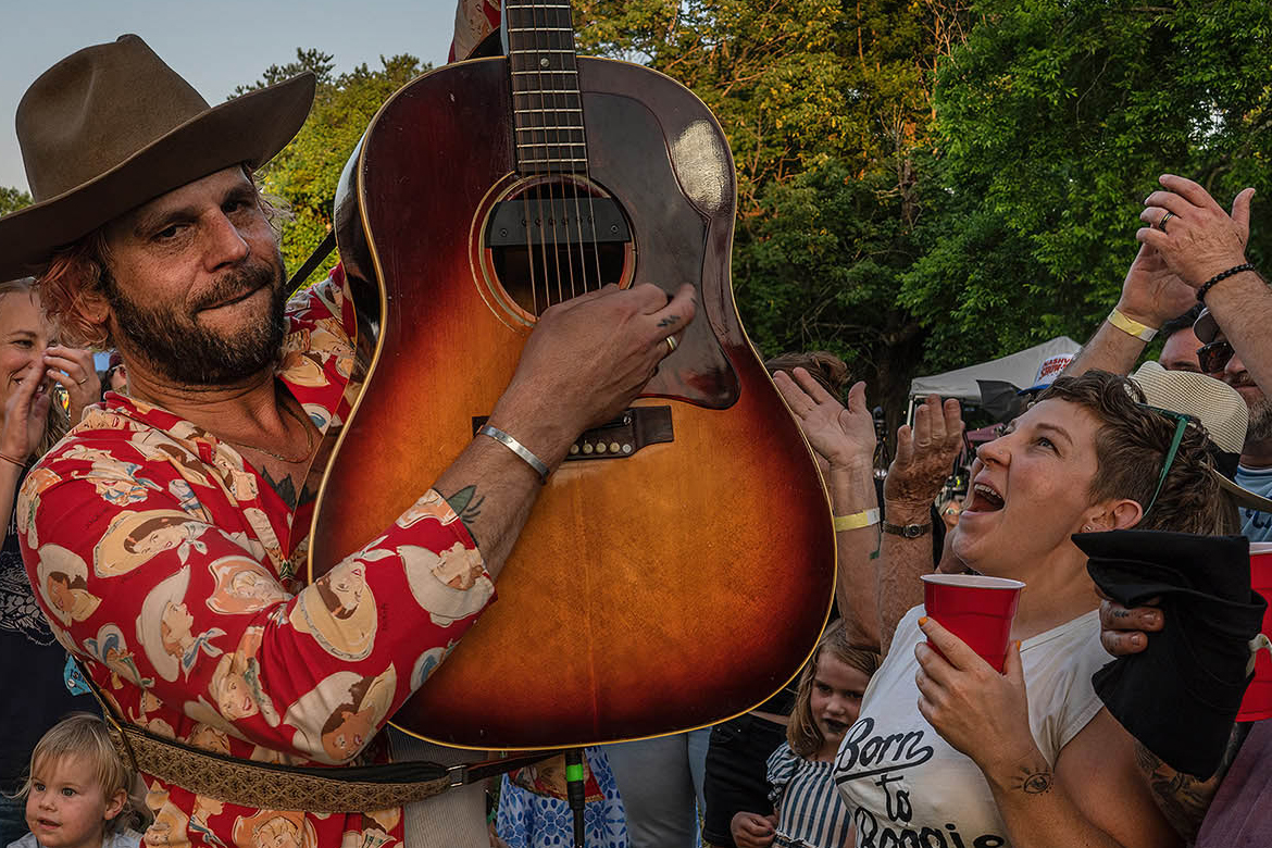Attendees listen and cheer for a performer at the annual “Roots on the Rivers” music festival held at Two Rivers Mansion in Nashville, Tenn. The annual fundraiser benefits Middle Tennessee State University's WMOT-FM Roots Radio 89.5. (Photo courtesy of John Partipilo/WMOT)