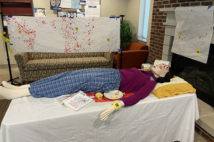 The highlight of the 2024 CSI: MTSU Forensic Summer Youth Camp for high schoolers held recently at Middle Tennessee State University in Murfreesboro, Tenn., was campers getting to solve a mock homicide scene set up at the MTSU Honors College, shown here. The camp is sponsored by MTSU’s Forensic Institute for Research and Education. (Submitted photo)