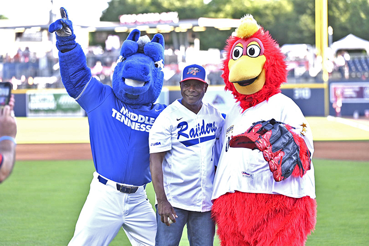 Middle Tennessee State University President Sidney A. McPhee, center, grabs a photo with MTSU mascot Lightning, left, and Nashville Sounds mascot Booster, right, at the Sounds’ special Military Appreciation Night game, which also marked True Blue Night at the Sounds, on Thursday, June 6, at First Horizon Park in Nashville, Tenn. McPhee threw out the ceremonial first pitch for the game. (MTSU photo by James Cessna)