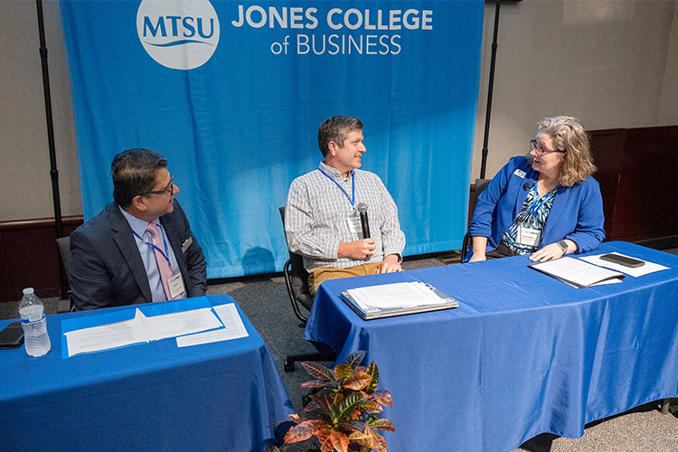 Pictured here, from left, are Murat Arik, director of the Business and Economic Research Center and holder of the Chair of Excellence in Urban and Regional Planning; Keith Jacks Gamble, director of MTSU’s Data Science Institute and an economics and finance professor, and Kristie Abston, associate management professor. Arik and Gamble were panelists and Abston was the moderator for a panel discussion Friday, May 31, during the ACM SIGMIS CPR 2024 information technology conference held in the State Farm Lecture Hall in the Business and Aerospace Building at Middle Tennessee State University in Murfreesboro, Tenn. (MTSU photo by Andy Heidt)