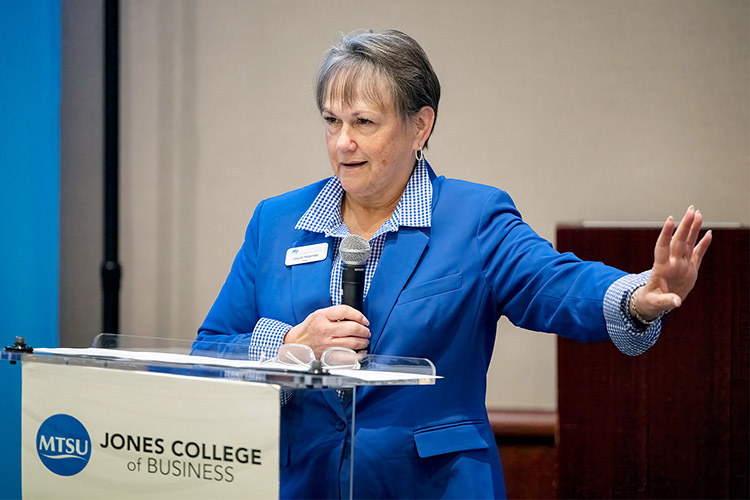 Joyce Heames, dean of the Jones College of Business welcomes attendees to ACM SIGMIS CPR 2024 on Thursday, May 30, 2024, during the inauguration ceremony in the Business and Aerospace Building’s State Farm Lecture Hall in Murfreesboro, Tenn. It marked MTSU’s first time hosting the international information technology conference, which attracted scholars from around the globe. (MTSU photo by Andy Heidt)