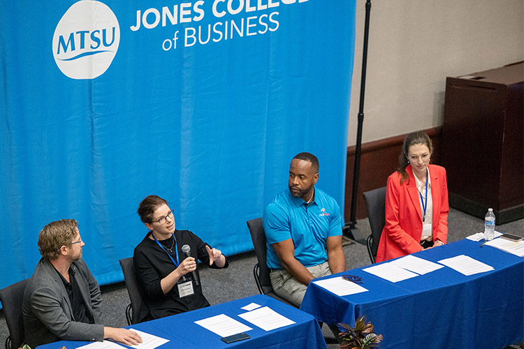 Pictured here, from left, are guest panelists Jon Hoscheit, founding partner for Data Suites Datacenters (Murfreesboro Data) and Murfreesboro Technology Council; Kristina Kusanke, professor at the University of Hagen, Germany; Joshua Mundy, CEO and co-founder of Pivot Technology School; and Jennifer Kendziorra, doctoral student at the University of Hagen, Germany. The four participated in a panel discussion Thursday, May 30, during the ACM SIGMIS CPR 2024 information technology conference held in the State Farm Lecture Hall in the Business and Aerospace Building at Middle Tennessee State University in Murfreesboro, Tenn. (MTSU photo by Andy Heidt)